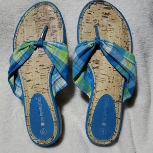 No boundaries,  blue, and green fabric  flip flops